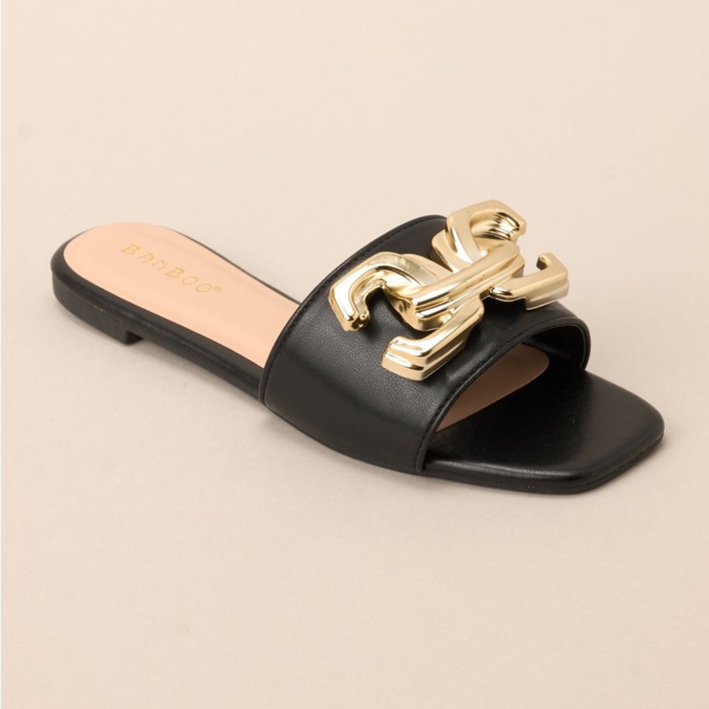 Bamboo black slide square toe sandals with chunky gold buckle hardware, size 7.5
